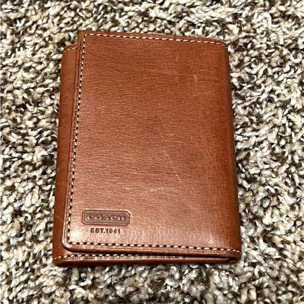 Brown Coach tri-fold wallet